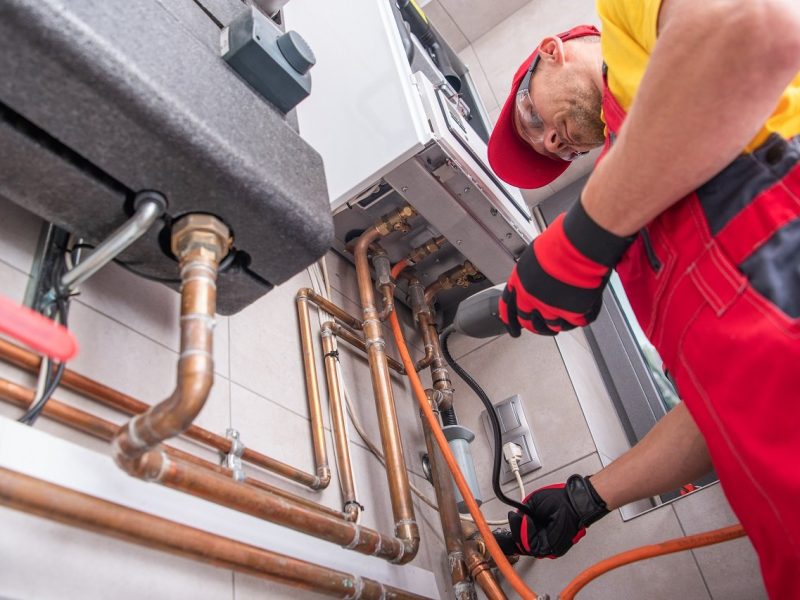 Professional Gas Heating Technician with Gas Detector