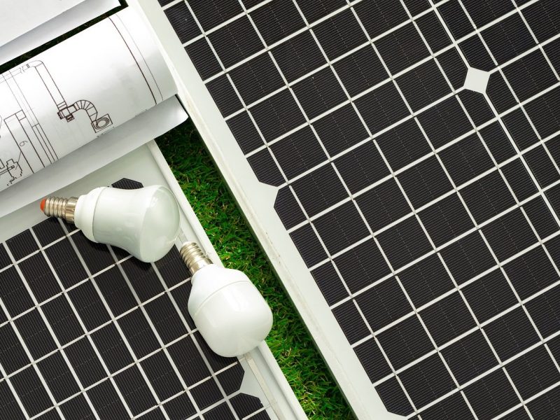 Solar energy panel and light bulb, green energy