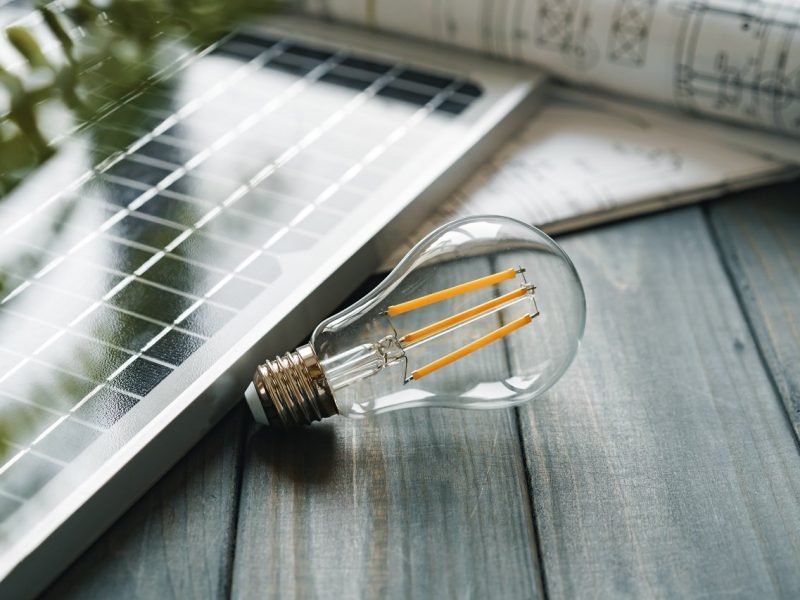 Solar energy panel and light bulb, green energy